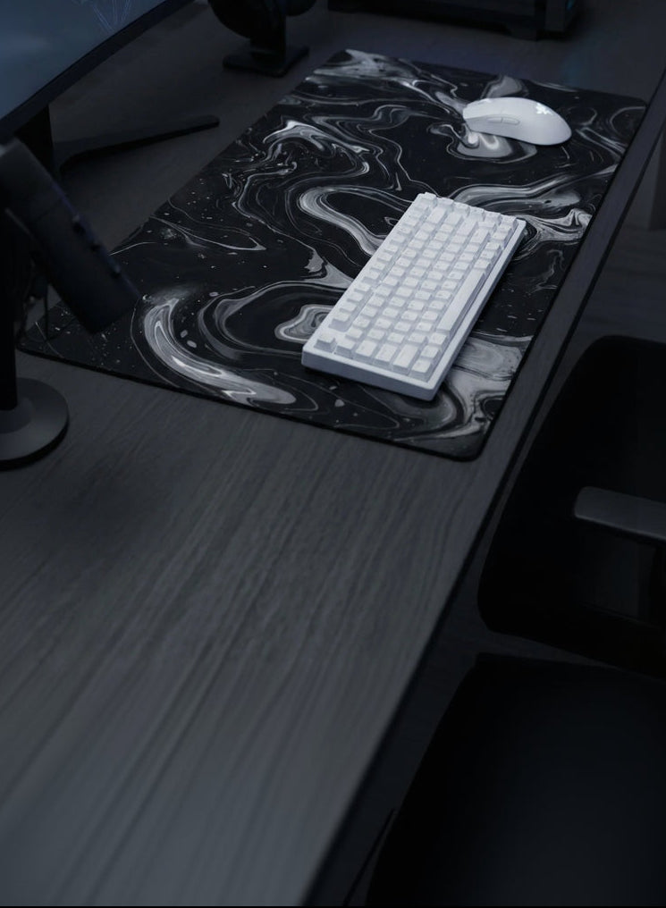 Modern computer setup with dual monitors, keyboard, and mouse on a desk.